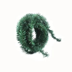 Detailed view of flexible 5.5m green Christmas pine garland for holiday tree decor