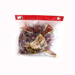 Christmas tree tinsel garland and gold bow set in festive red retail packaging