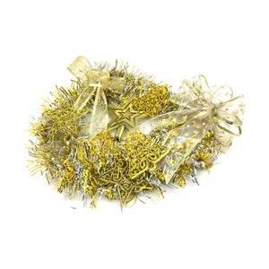 Detailed view of gold and silver Christmas tinsel wreath with star and bell ornaments