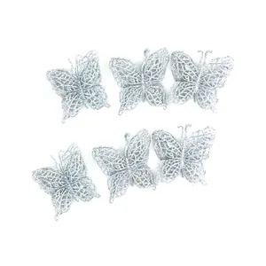 Detailed view of six silver glitter butterfly ornaments for Christmas tree decor