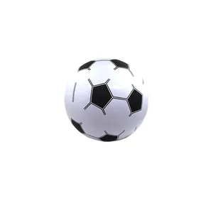 Detailed view of white inflatable soccer beach ball featuring classic black pentagon designs