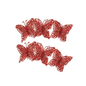 Detailed view of six red glittery butterfly ornaments for Christmas tree decoration
