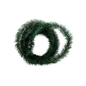 Detailed view of coiled 5.5m green Christmas tinsel garland for festive tree decoration
