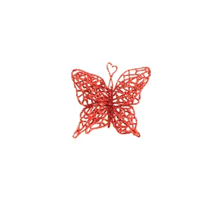 Detail shot of red glitter butterfly Christmas tree ornament for DIY festive decor