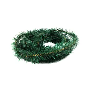 Macro view showing the texture of a 5.5m green Christmas tinsel garland with gold accents