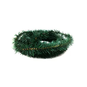 Macro view of a 5.5m dark green Christmas rattan garland for festive tree decoration
