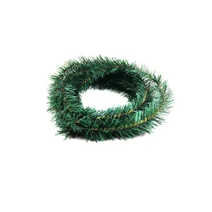 Close-up of flexible 5.5m green Christmas garland tinsel for festive tree decoration