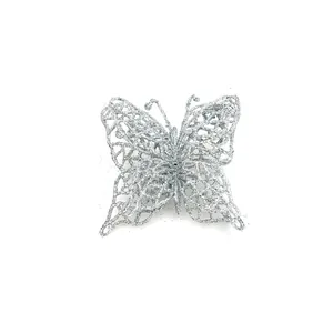 Detailed view of a silver glitter butterfly ornament for Christmas tree decor