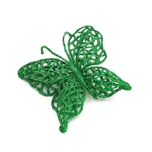 Macro view of green glitter PVC butterfly ornament for Christmas tree DIY decoration