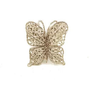 Detailed macro view of a golden glitter mesh butterfly Christmas tree hanging ornament