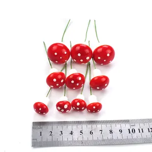 Detailed view of mini red foam mushrooms with wire stems and scale measurement