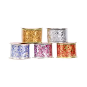 Detailed view of five colorful metallic bronzing Christmas ribbons for DIY décor