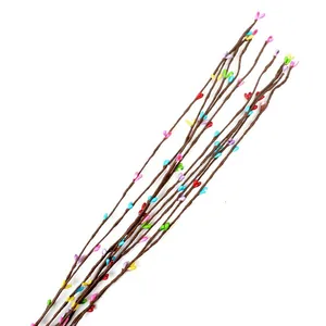 Close-up detail of colorful artificial berry vines for DIY crafts and home decoration
