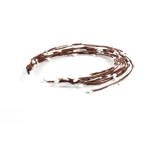Detailed view of artificial brown berry vines featuring white pip buds for DIY home decor