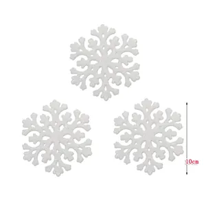 Detailed view of three 10cm white glitter acrylic snowflake ornaments for tree