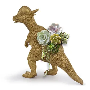 Detailed view of a golden Pachycephalosaurus resin planter with lush succulents