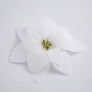 Detail view of a white artificial poinsettia flower used for Christmas tree decorations