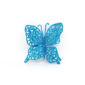 Macro detail view of a shimmering blue glitter butterfly ornament for Christmas tree DIY