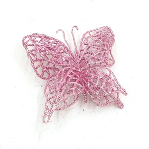 Close-up macro view of a pink glittery butterfly ornament for Christmas tree DIY decoration