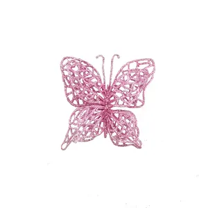 Detail macro view of a pink glittery PVC butterfly Christmas tree ornament accessory
