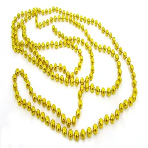 Close-up detail of shiny golden beads on a decorative chain for Christmas trees