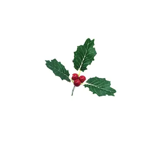 Macro detail of artificial Christmas holly berries with three green serrated leaves