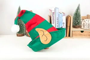 Macro view of a red and green striped Christmas elf hat with pointed ears detail