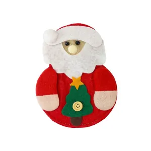 Close-up of handmade non-woven Santa Claus cutlery bag featuring a felt Christmas tree