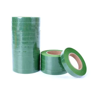 Detailed view of multiple green floral tape rolls for DIY flower bouquet stem wrapping.