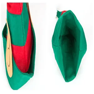 Detail view of a red and green striped Christmas elf hat with pointed ears for kids.