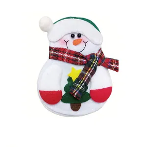 Close-up detail of a festive non-woven fabric snowman Christmas cutlery holder pouch