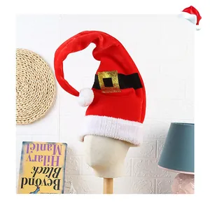 Detailed view of red elf Christmas hat with gold buckle belt and white fuzzy trim