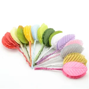 Variety of colorful artificial leaves with wire stems for DIY wedding and craft projects.