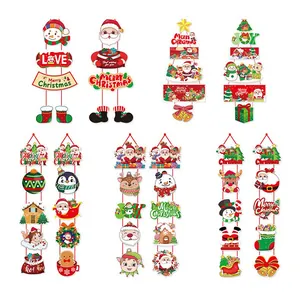 Variedad de estandartes navideños de papel para puertas con Papá Noel y muñeco nieve.