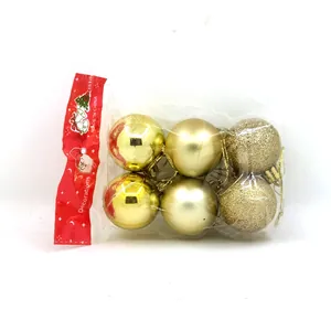 Juego de seis bolas de Navidad doradas con acabados brillantes mates y purpurina