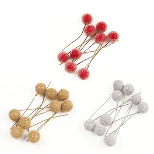 Artificial Christmas berries in red, gold, and silver for DIY holiday gift box decorations.