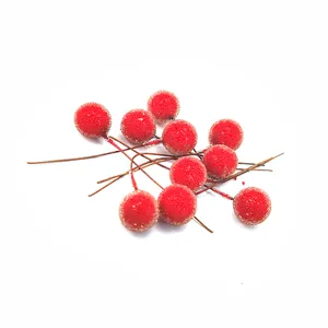 Detailed view of frosted red artificial berries used for Christmas DIY craft decoration