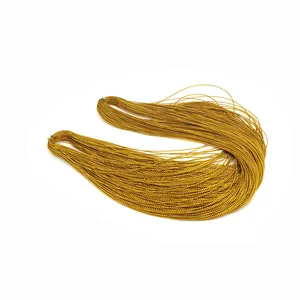 Close-up detail of bundled golden metallic cord thread for gift wrapping and tags
