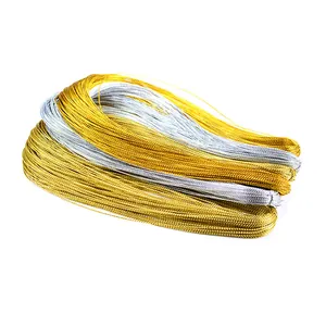 Close-up detail of metallic gold and silver ropes for gift wrapping and decoration