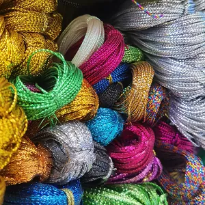 A close-up detailed view of assorted colorful metallic silk threads for gift wrapping decor