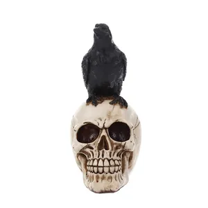 Macro detail of a realistic resin skull figurine with a black crow perch, Halloween decor.