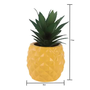 Dimension view of a yellow pineapple resin faux succulent plant ornament 17cm in height