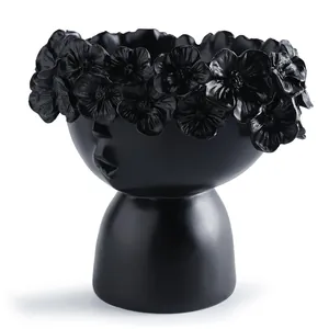 Creative matte black face-shaped resin flower pot with detailed floral crown decoration