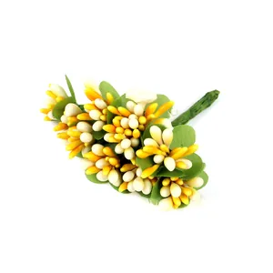 Detailed view of artificial bead flower stamen with green leaves for DIY craft projects.