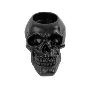 Front view of a matte black resin skull ashtray and Halloween decorative ornament