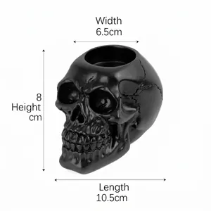 Black resin skull ashtray and candle holder with dimensions: 10.5x6.5x8cm