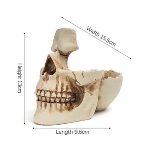 Detailed view of resin skull eyeglass holder with dimensions showing 13cm height