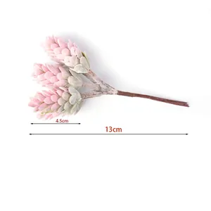 Detail of artificial pine cone bouquet showing 13cm overall length and 4.5cm head size.