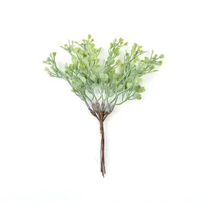 Detailed view of artificial green heart-shaped leaf plastic bouquet for DIY home decor