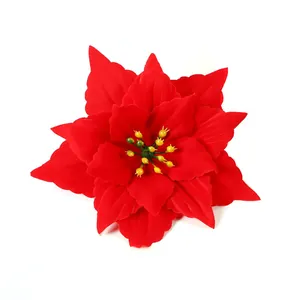 Close-up detail of vibrant red artificial poinsettia flower for Christmas decorations
